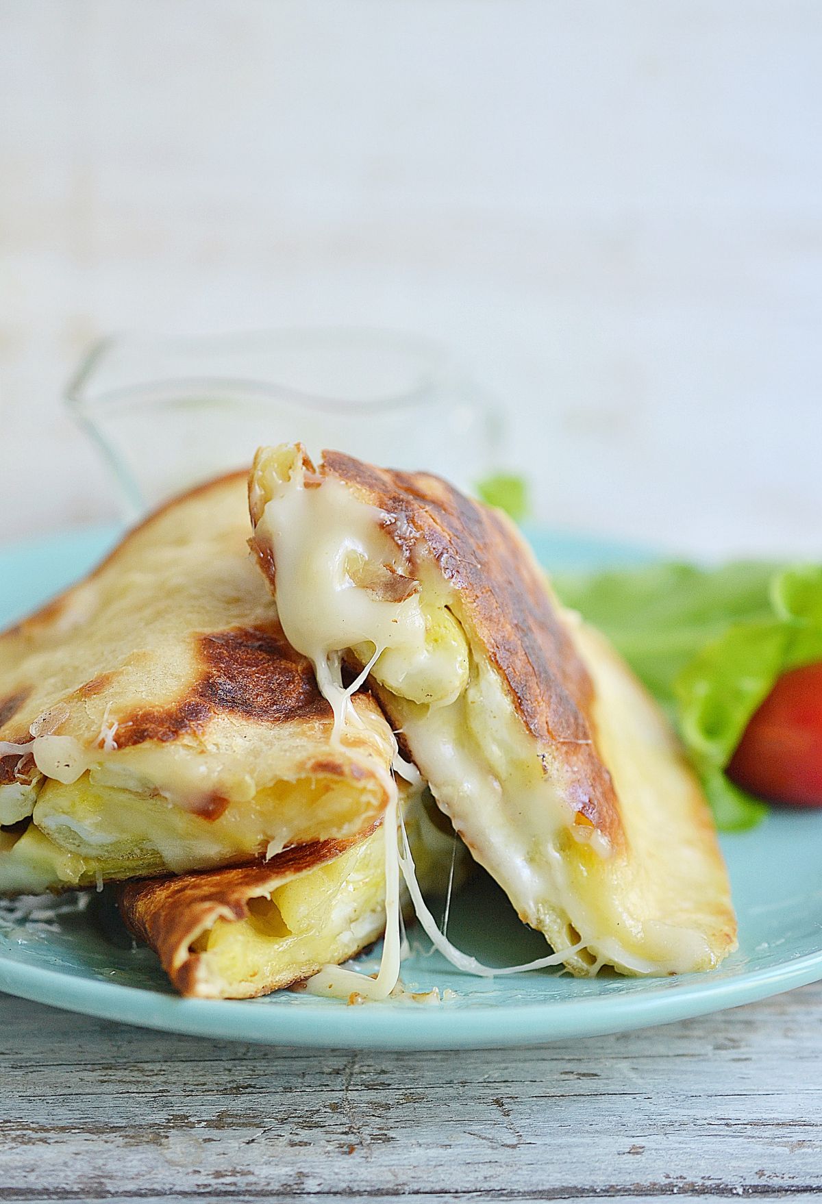 Quesadillas on a blue plate.