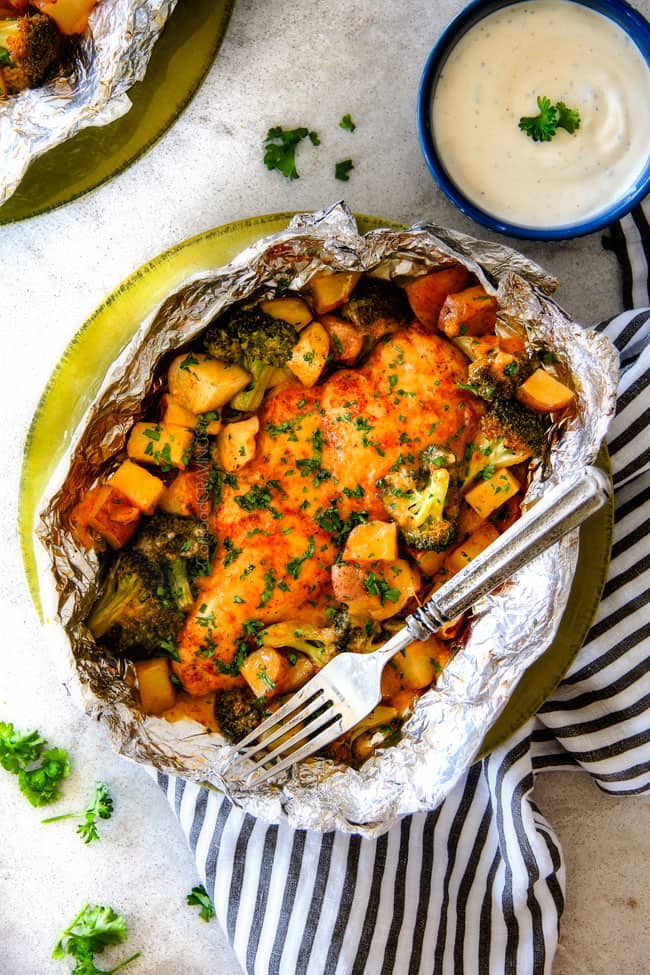 Foil packets filled with chicken tossed in buffalo sauce.