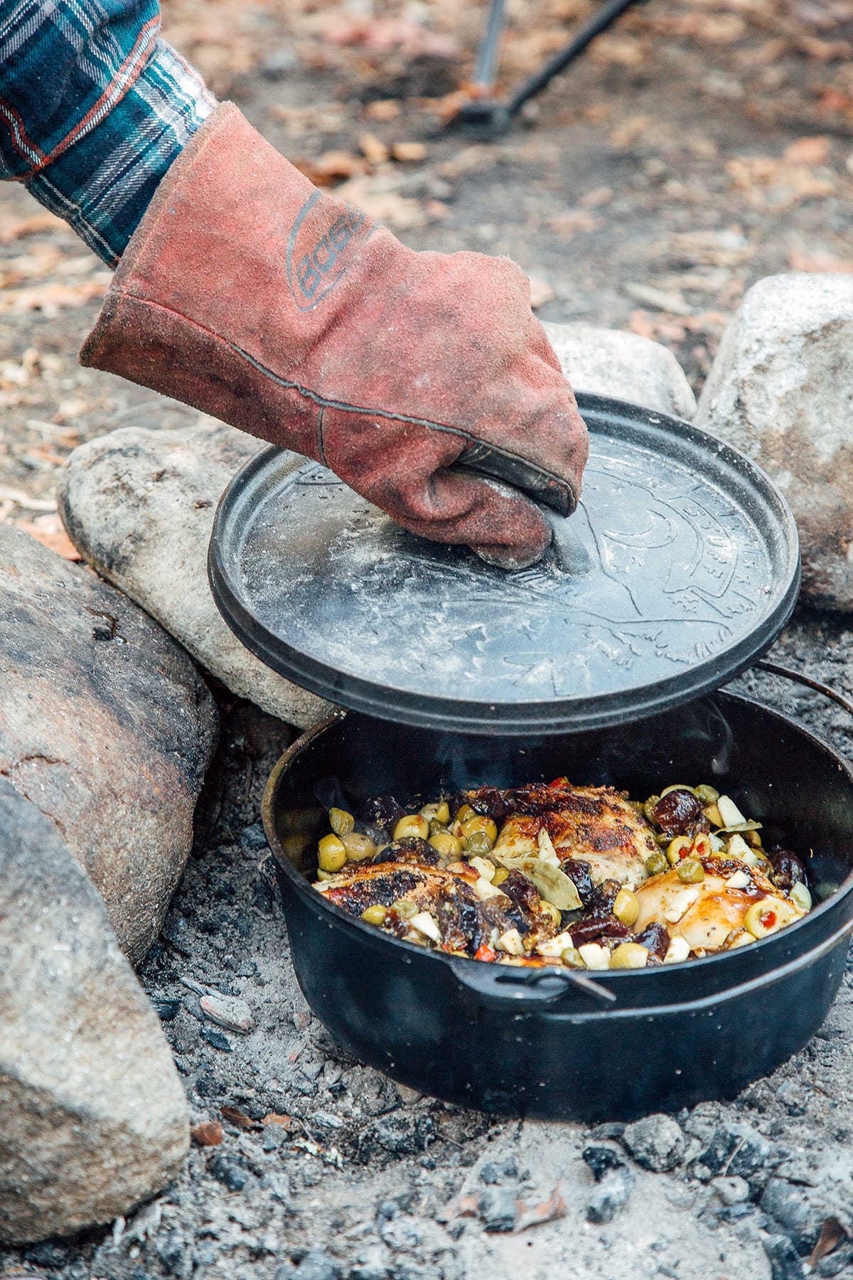 Michael lifting the lid off of a Dutch oven