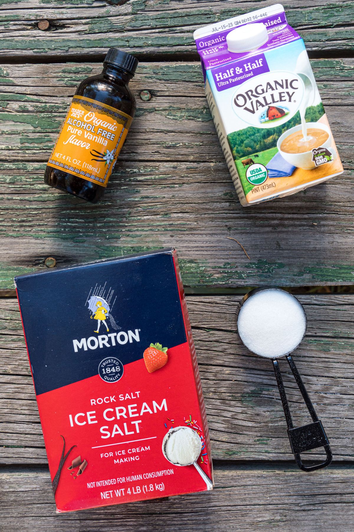 Ingredients for ice cream in a bag on a wooden table.