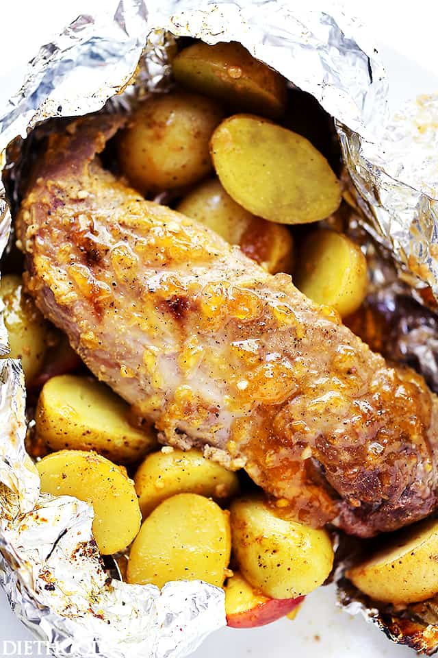 Pork tenderloin and potatoes in foil.