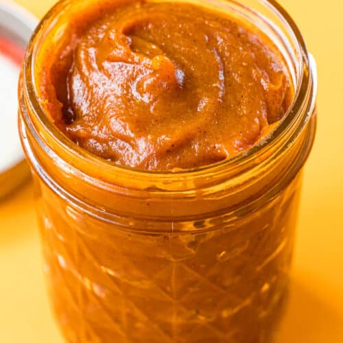 Pumpkin butter in a glass jar.