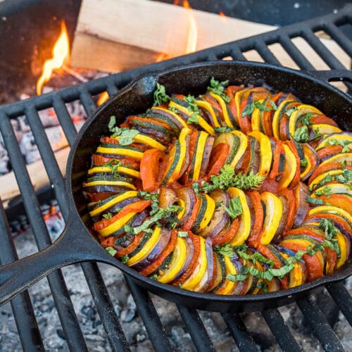 Ratatouille in a skillet over a campfire