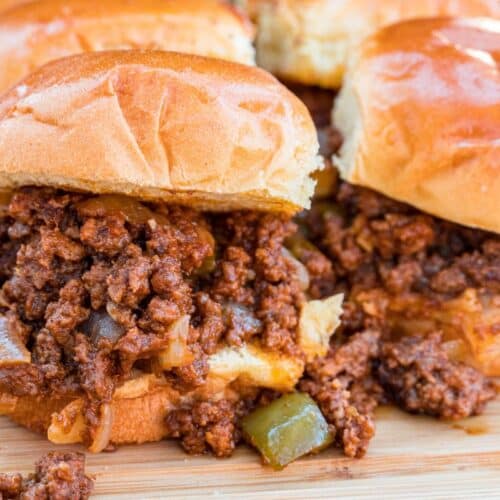 Sloppy joes on a board, ready to serve.