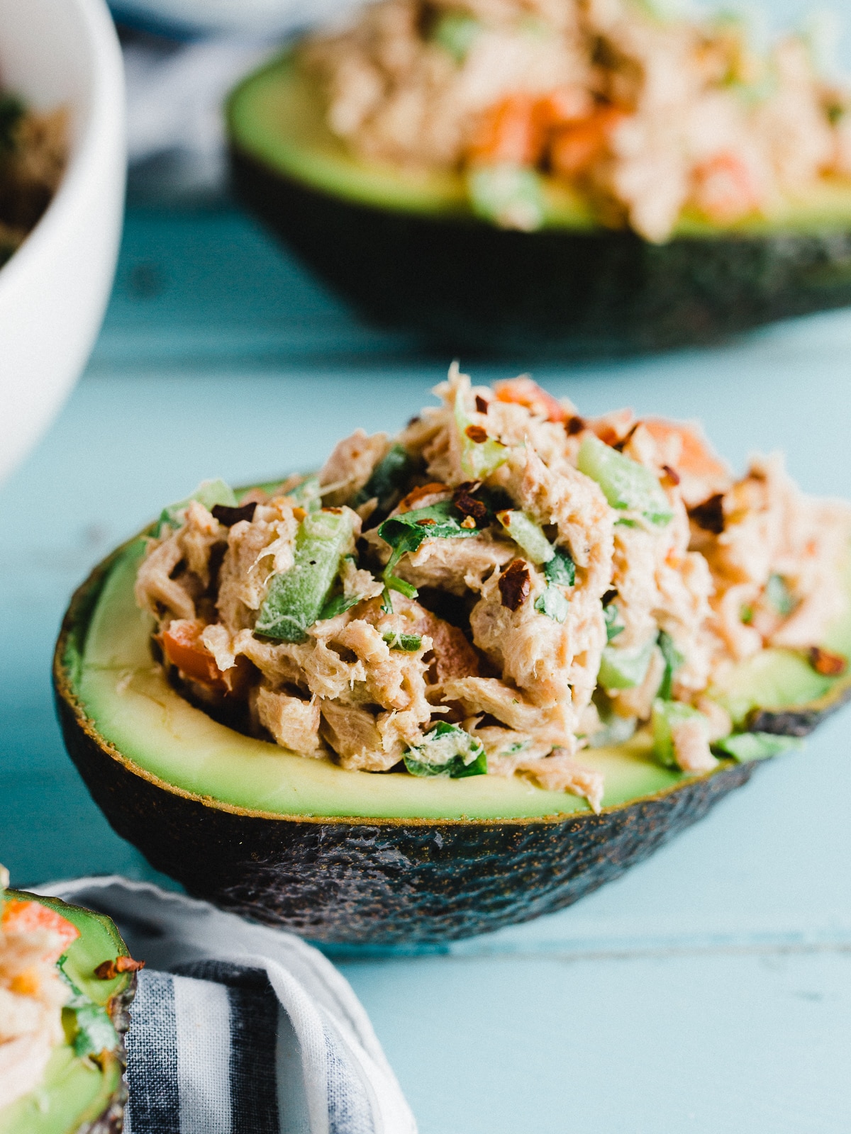 Half an avocado stuffed with tuna salad.