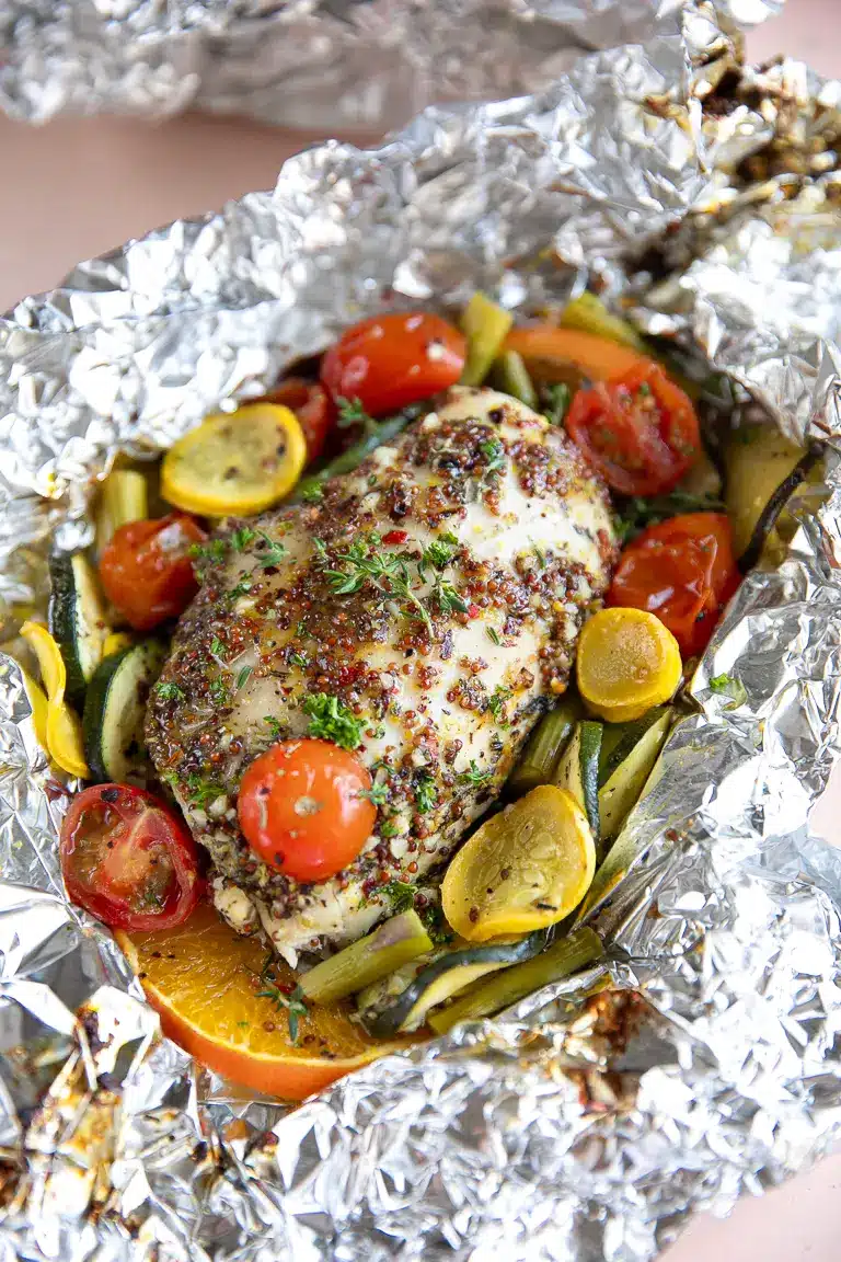 Chicken with mustard sauce and vegetables.