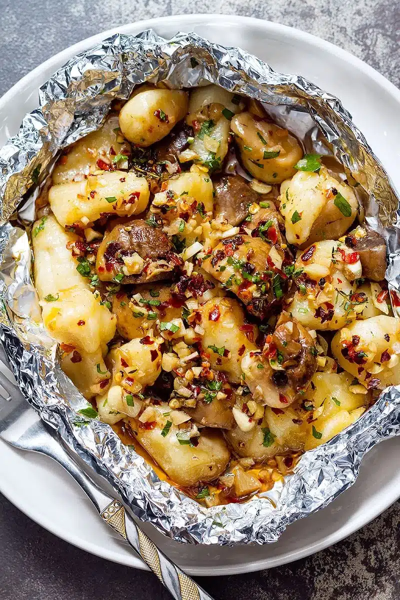Gnocchi and mushrooms in foil.